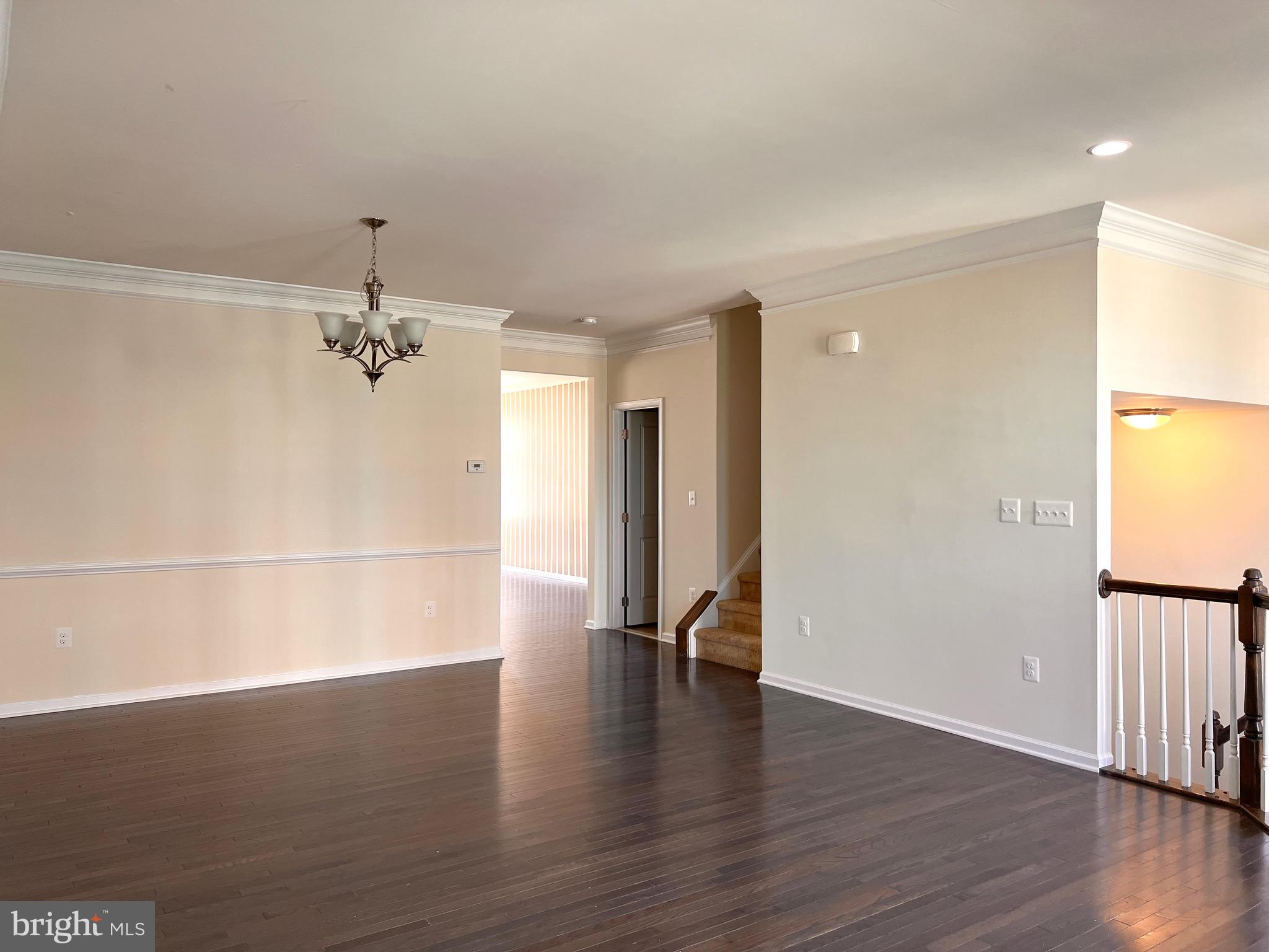 23480 Logans Ridge Terrace Ashburn, VA 20148 - Photo 8 of 66 wooden floor in an empty room with a window