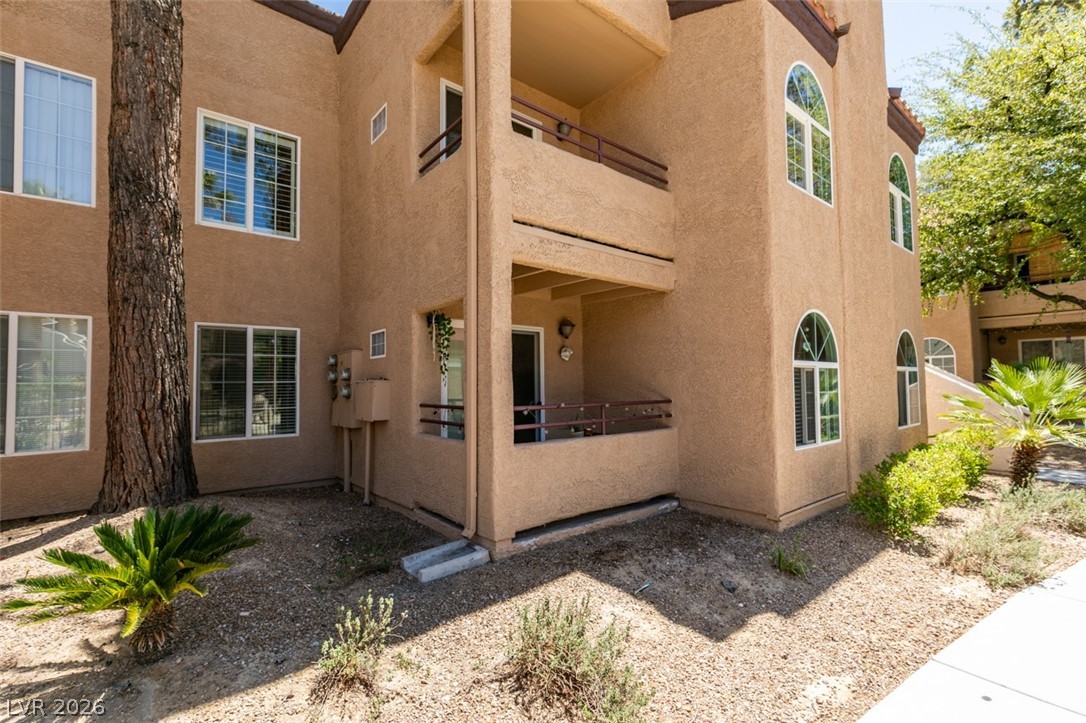 9325 West Desert Inn Road, Unit 244 Las Vegas, NV 89117 - Photo 3 of 55 A welcoming balcony and arched windows enhance the multi-story structure's curb appeal.
