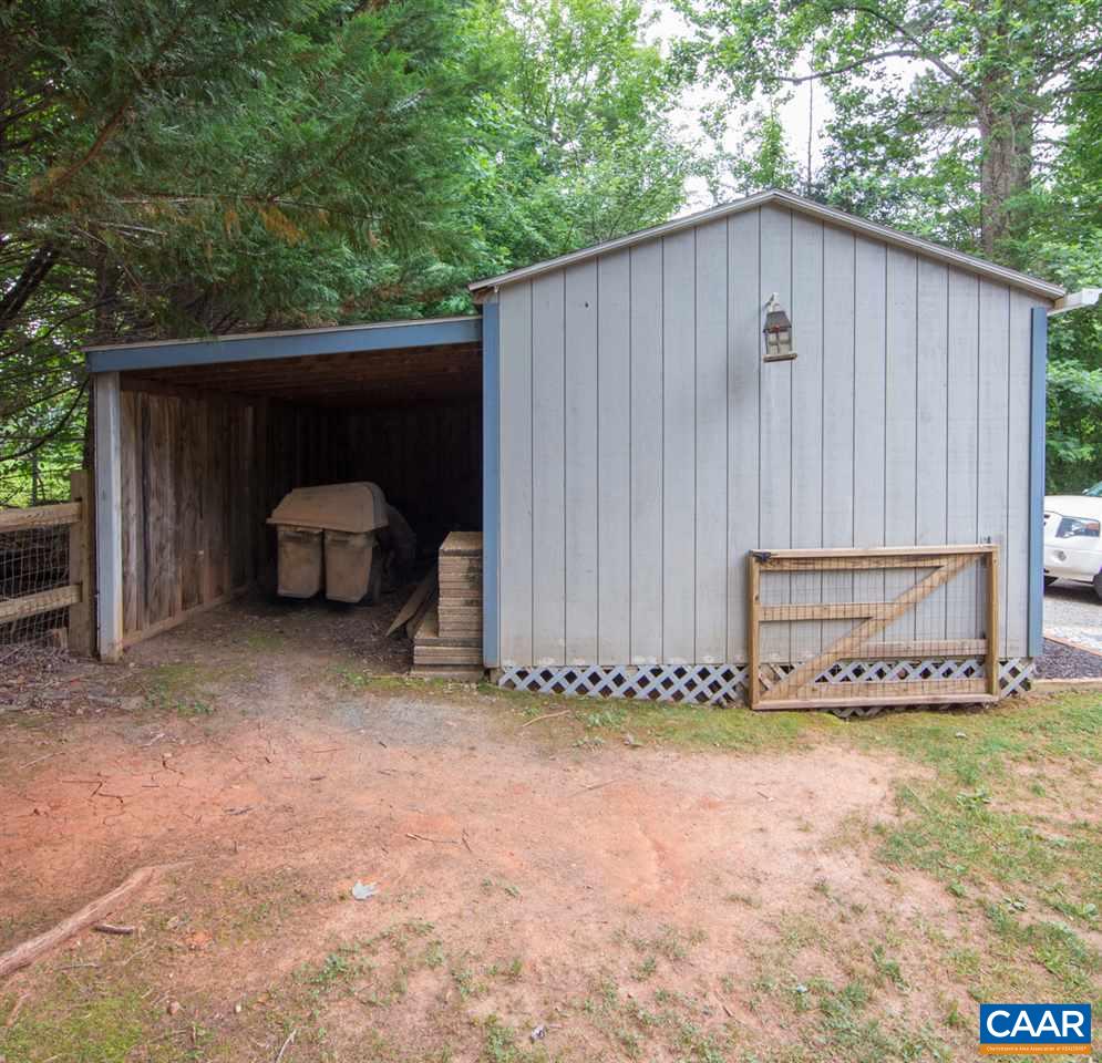 330 Larkspur Road Ruckersville, VA 22968 - Photo 25 of 28 a wooden house with trees in the background