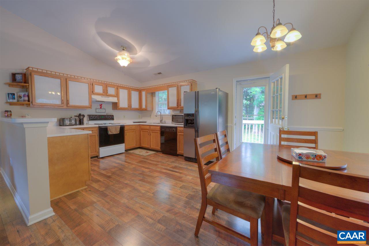 330 Larkspur Road Ruckersville, VA 22968 - Photo 8 of 28 a view of kitchen with cabinets stove and refrigerator