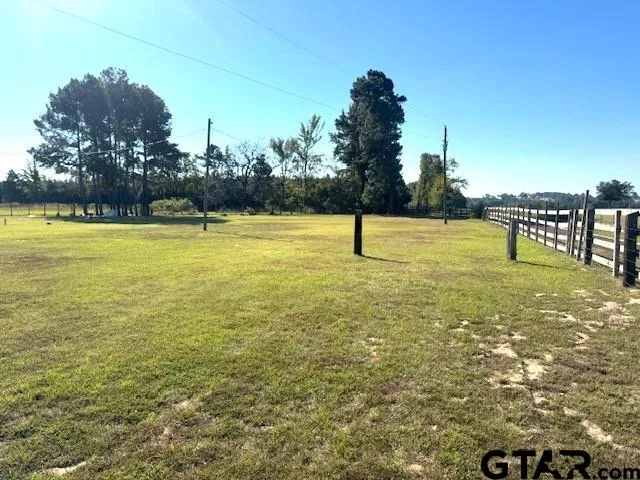 a view of a swimming pool with an outdoor space and seating area