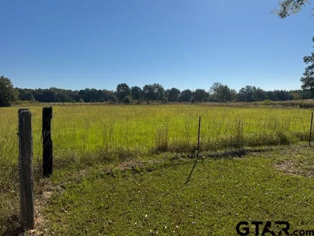 a view of a lake with houses in the back