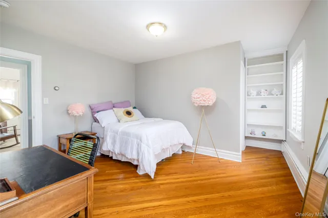 a bedroom with a bed and a table in it