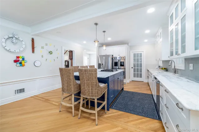 a large kitchen with stainless steel appliances granite countertop plenty wooden cabinets