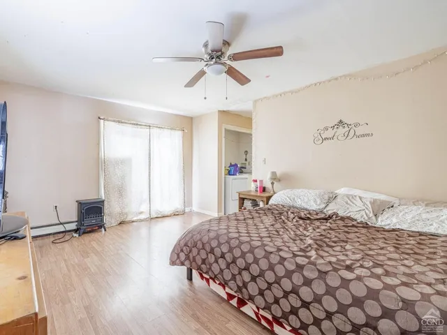 a utility room with cabinets washer and dryer