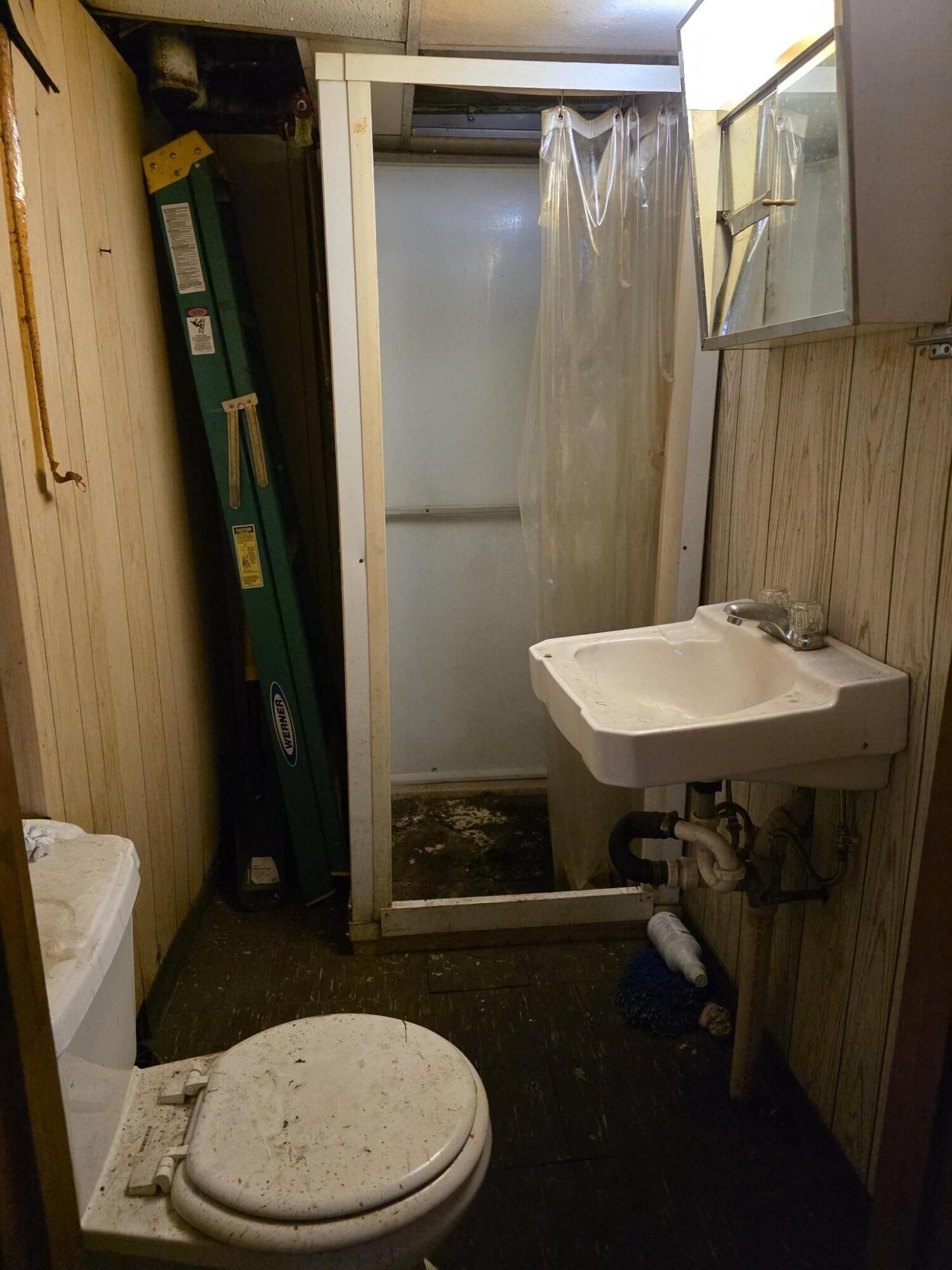 794 Porter Street Gary, IN 46406 - Photo 9 of 15 a bathroom with a toilet and a sink