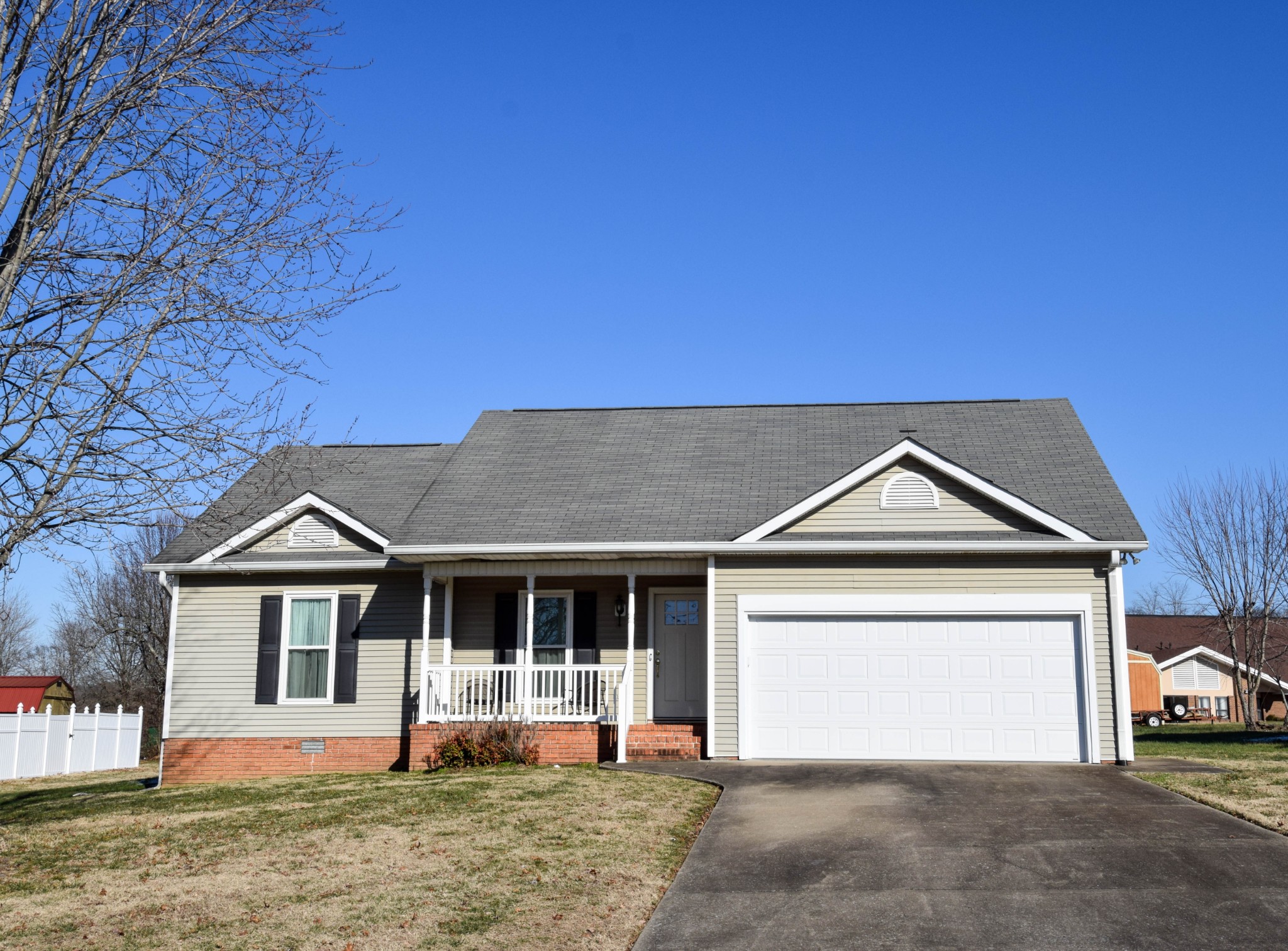 156 Hampton Place Gallatin, TN 37066 - Photo 1 of 1 a front view of a house with a yard and garage
