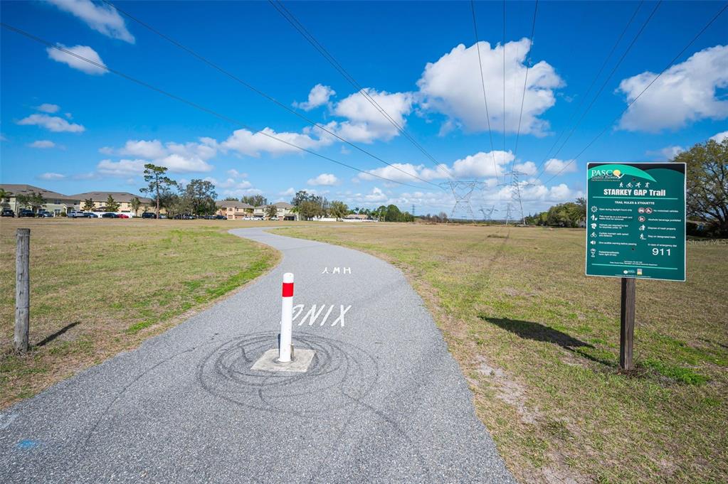 9736 Trumpet Vine Loop Trinity, FL 34655 - Photo 28 of 35 a view of a lake with a outdoor space