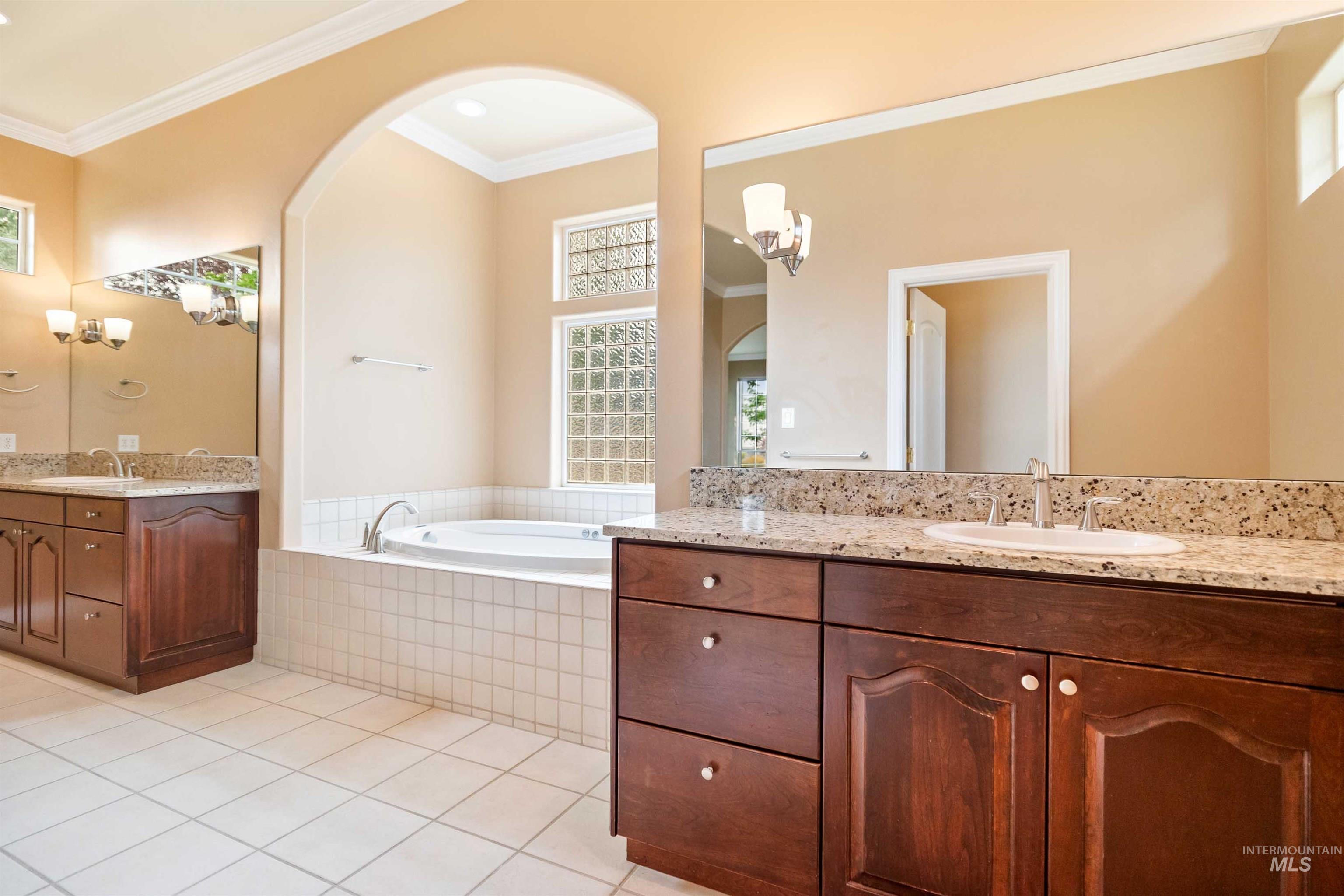 3404 Ridge Line Drive Kimberly, ID 83341 - Photo 20 of 50 Spa-inspired bathroom featuring a built-in jetted tub under an arched alcove with glass block windows