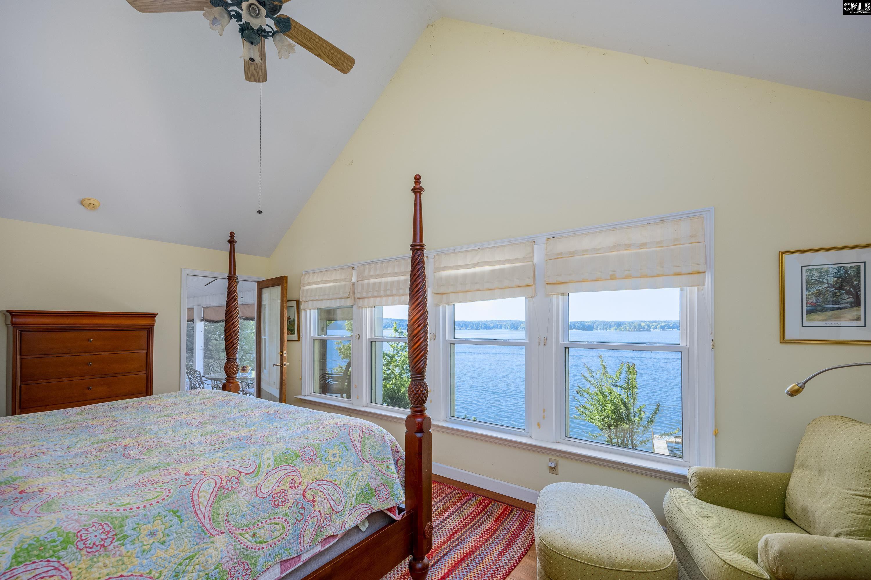 2577 Harbor View Road Camden, SC 29020 - Photo 23 of 42 a bedroom with a bed window and a chandelier
