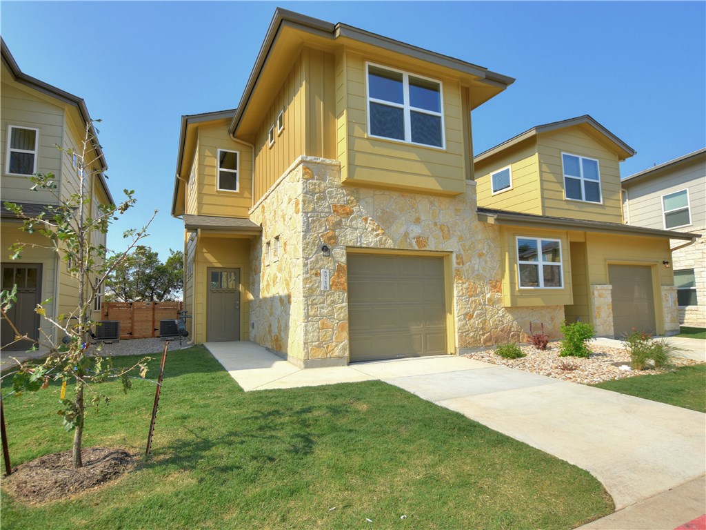 8925 Parker Ranch Circle, Unit B Austin, TX 78748 - Photo 1 of 1 a front view of a house with a yard