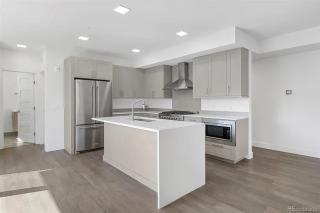 a bathroom with double sink and a mirror