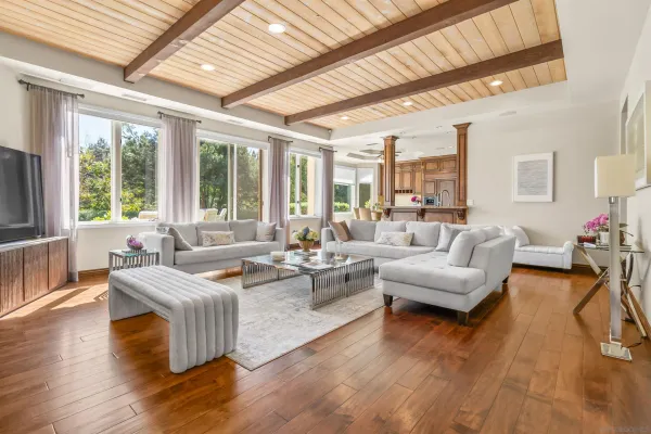 a view of a dining room with furniture wooden floor and a chandelier