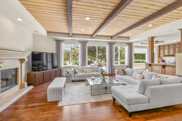 a bedroom with a large bed and a large window