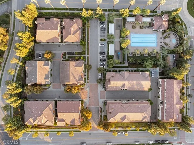 an aerial view of houses with yard