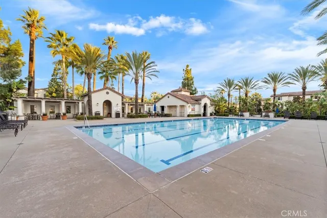 a view of swimming pool with outdoor seating
