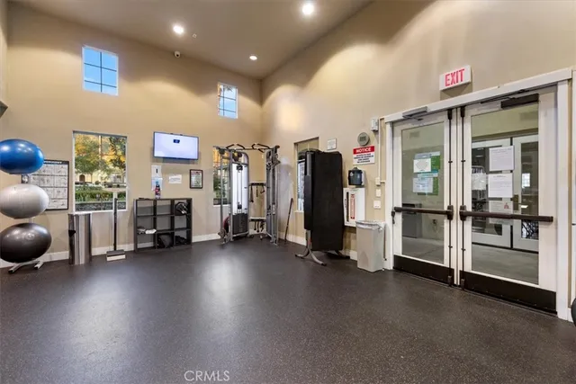 a view of a livingroom with furniture and a flat screen tv