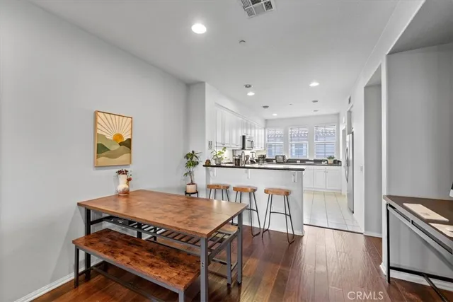 a kitchen with a table and chairs