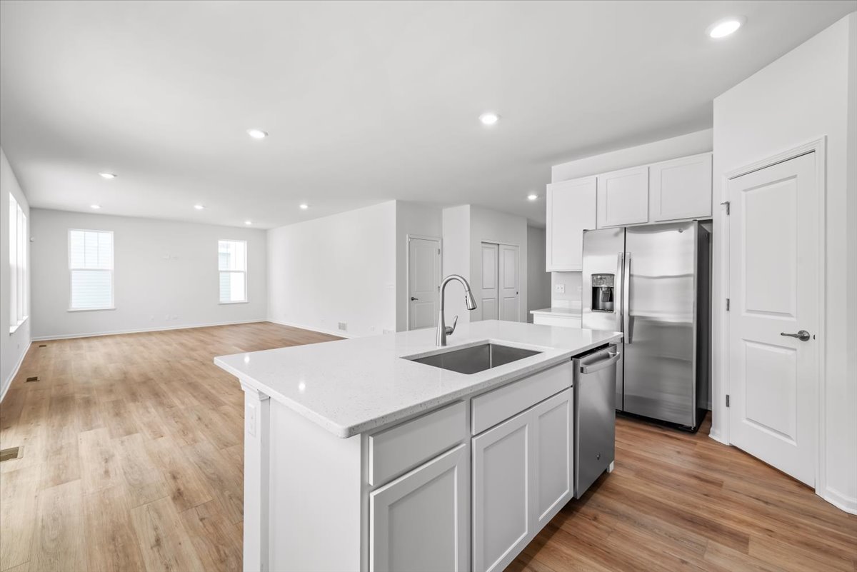 81 Sweetflag Circle Elgin, IL 60124 - Photo 13 of 51 a kitchen with a sink stove and refrigerator