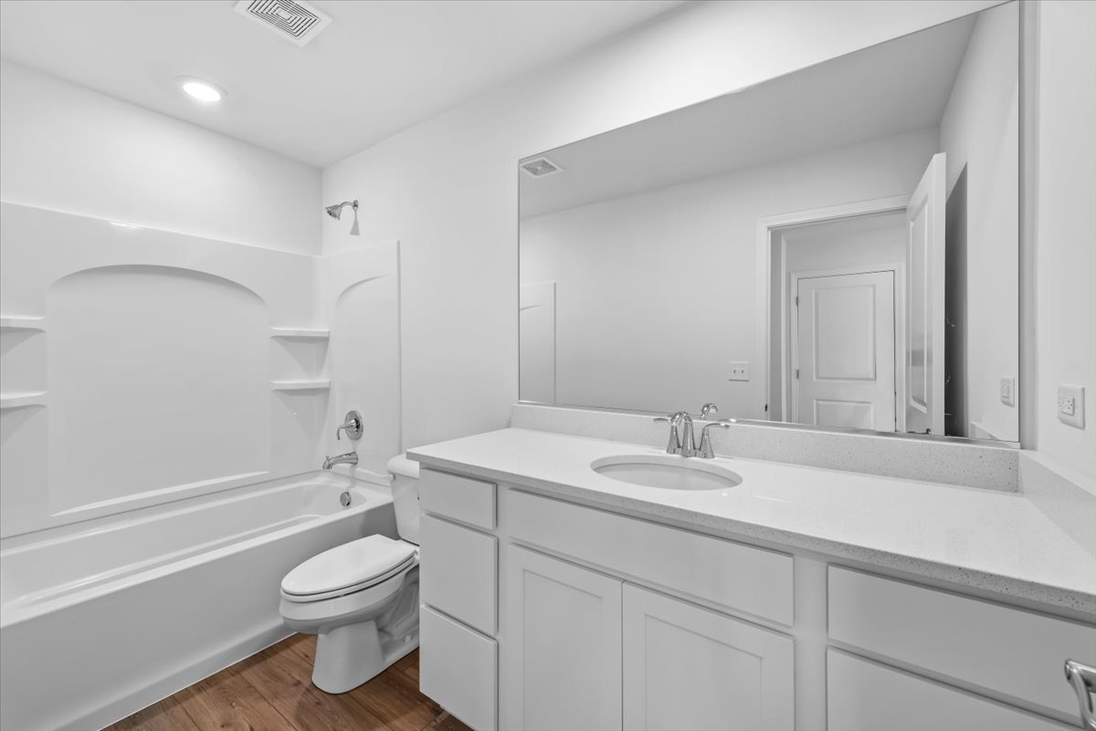 81 Sweetflag Circle Elgin, IL 60124 - Photo 23 of 51 a bathroom with a sink a toilet and a bathtub