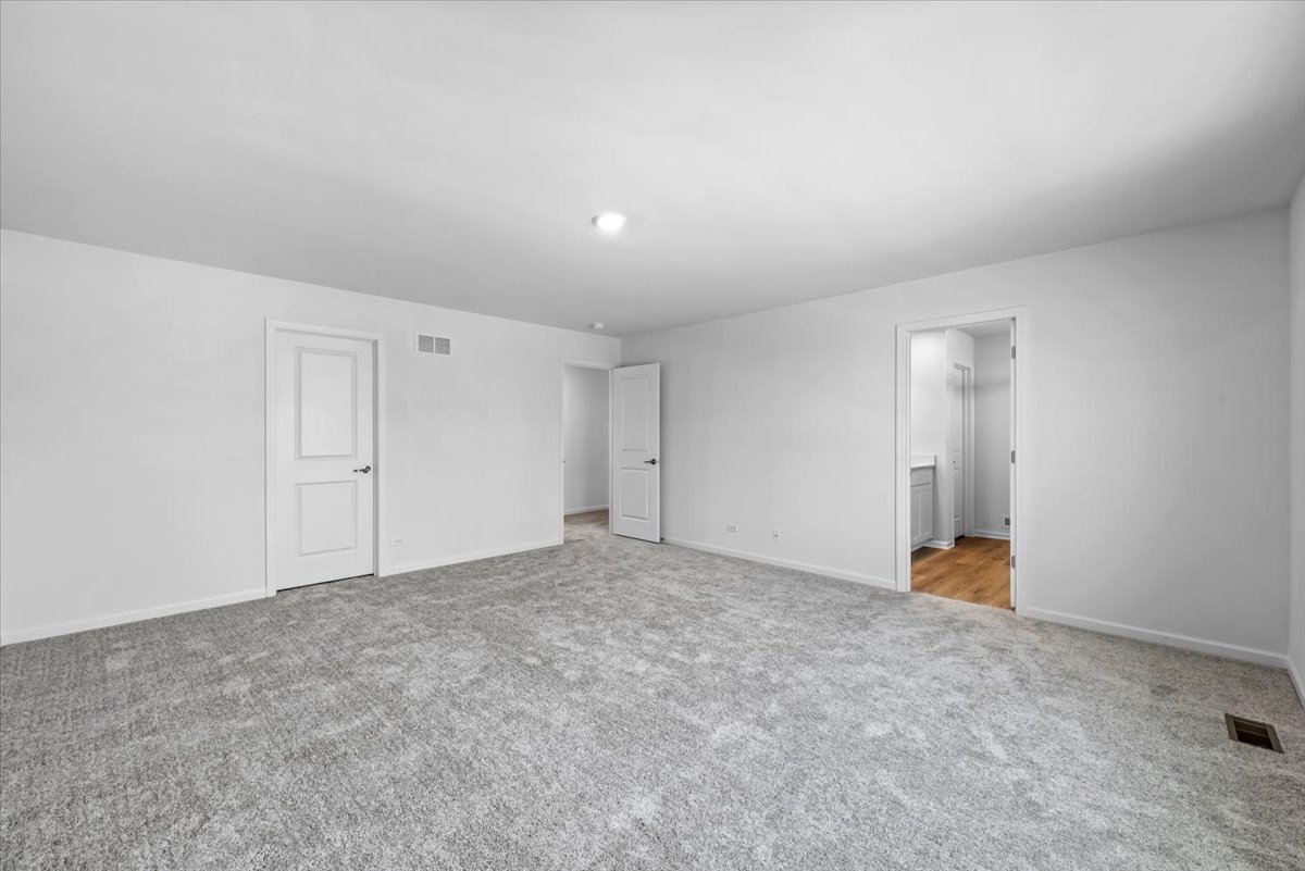 81 Sweetflag Circle Elgin, IL 60124 - Photo 28 of 51 an empty room with an entryway