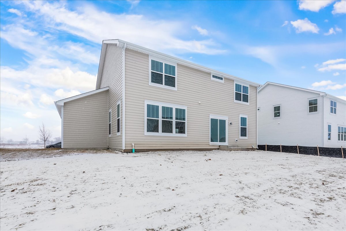 81 Sweetflag Circle Elgin, IL 60124 - Photo 6 of 51 a view of a house with a snow in the background