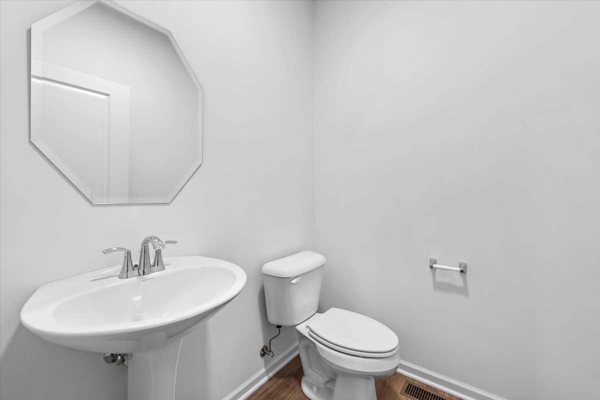 81 Sweetflag Circle Elgin, IL 60124 - Photo 10 of 51 a bathroom with a sink a toilet and a mirror