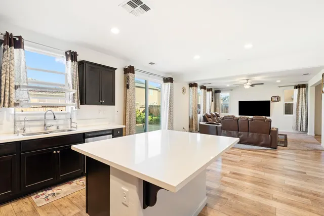 a utility room with sink dryer and washer