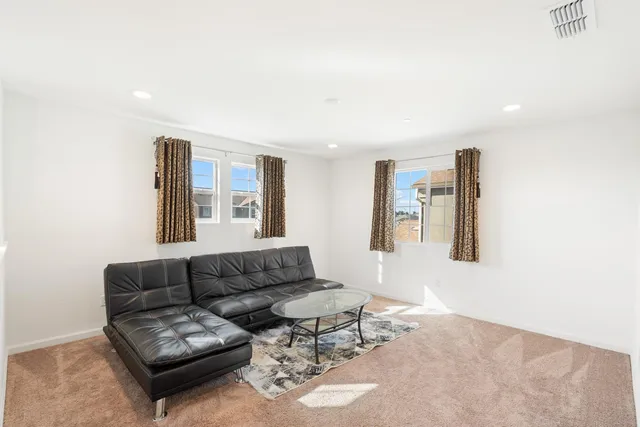 a living room with furniture and a rug