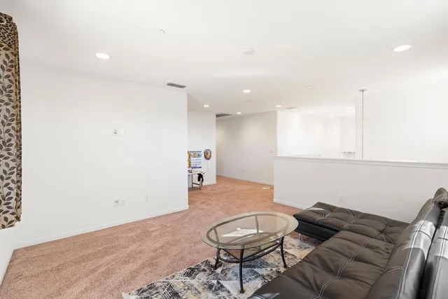 a view of a hallway with staircase
