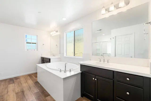 a bathroom with a bathtub and a shower