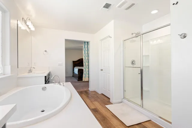 a white toilet sitting next to a white wall