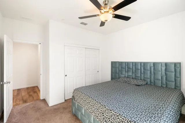 a dining room with furniture and wooden floor