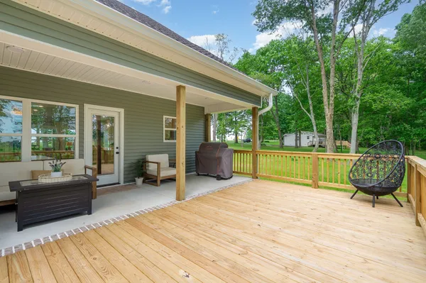 a view of a patio with couches chairs and a patio
