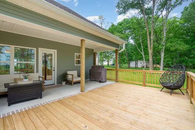 a view of a patio with couches chairs and a patio