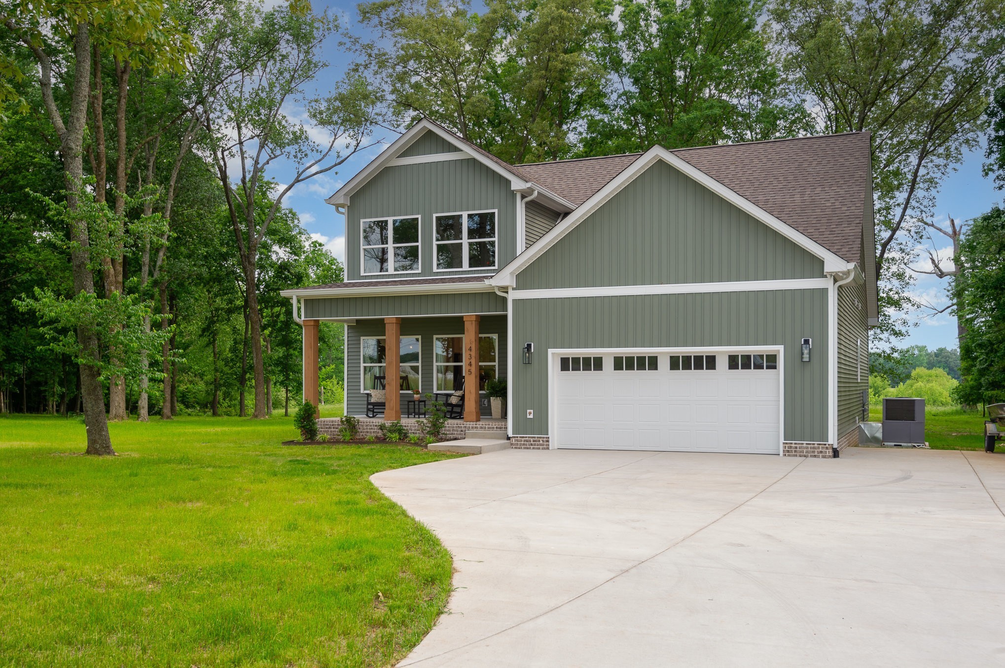 4345 South Garrett Road Springfield, TN 37172 - Photo 3 of 30 a front view of a house with a yard and trees