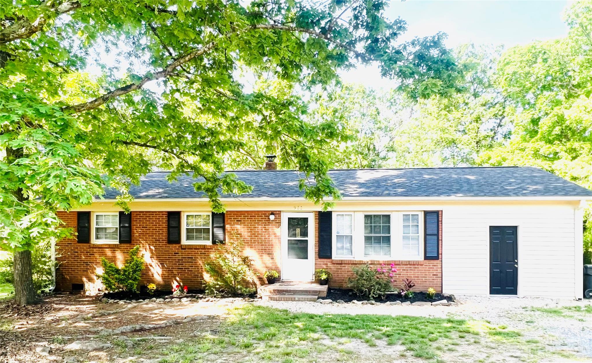 911 Taylor Street Wingate, NC 28174 - Photo 1 of 12 front view of a house with a yard