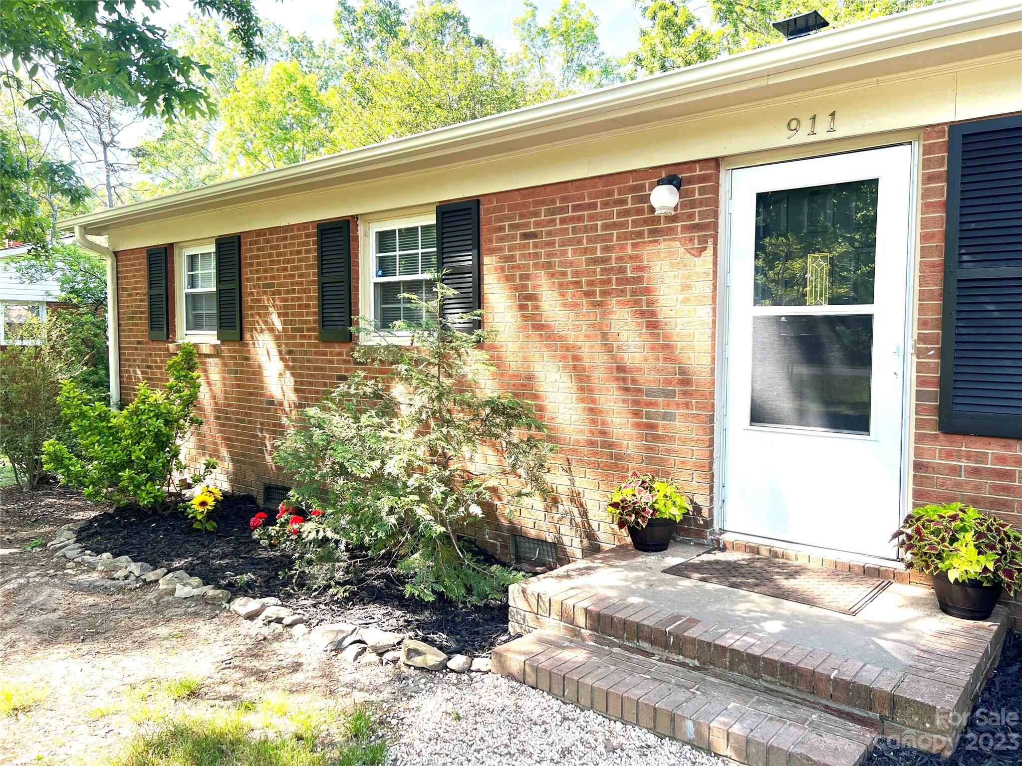 911 Taylor Street Wingate, NC 28174 - Photo 4 of 12 a front view of a house with a yard