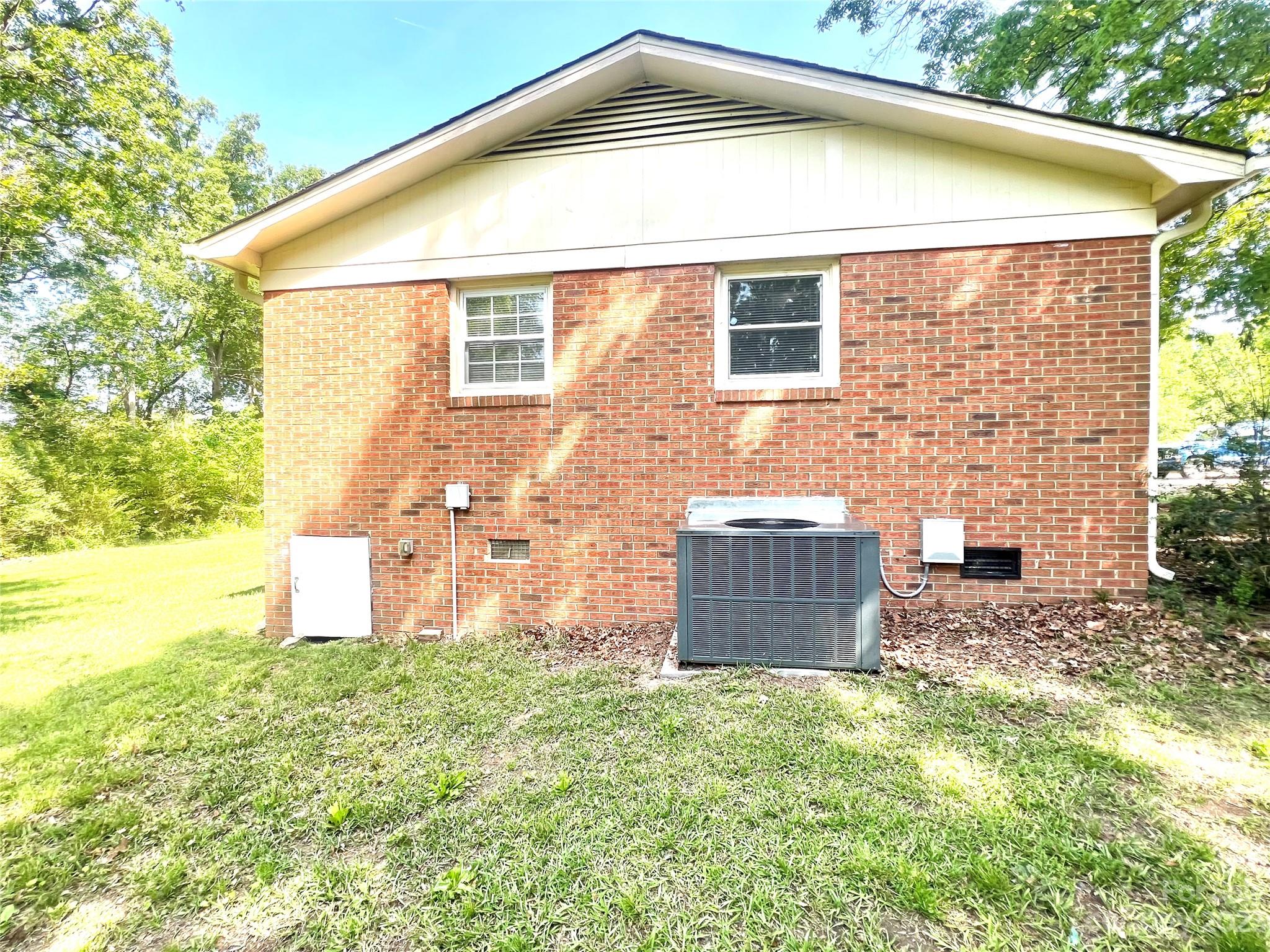 911 Taylor Street Wingate, NC 28174 - Photo 7 of 12 a front view of a house with a yard