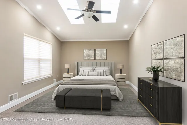 a bedroom with a large bed and a window