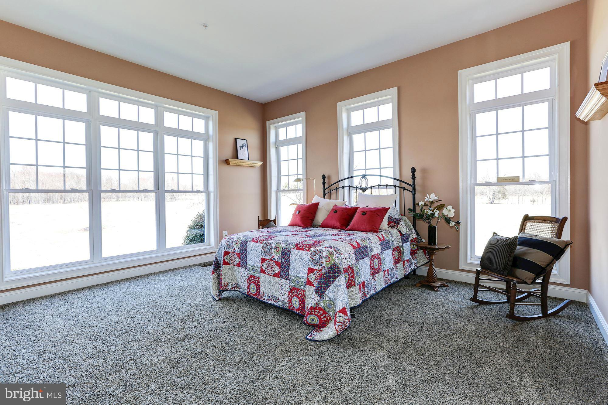 15520 Mount Nebo Road Poolesville, MD 20837 - Photo 16 of 30 a bedroom with a bed chair and two large window
