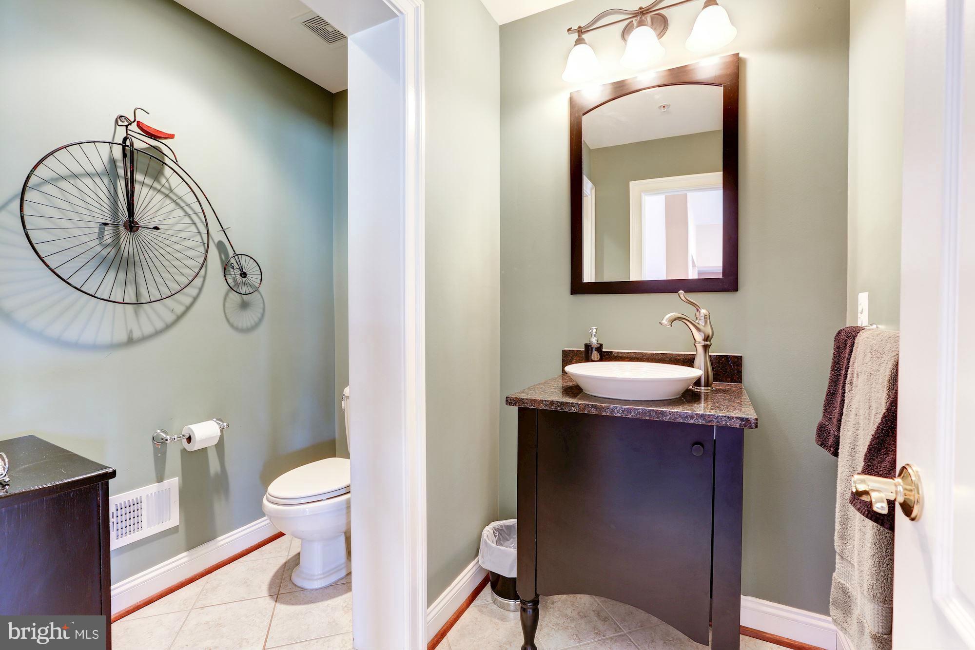 15520 Mount Nebo Road Poolesville, MD 20837 - Photo 17 of 30 a bathroom with a toilet a sink and mirror