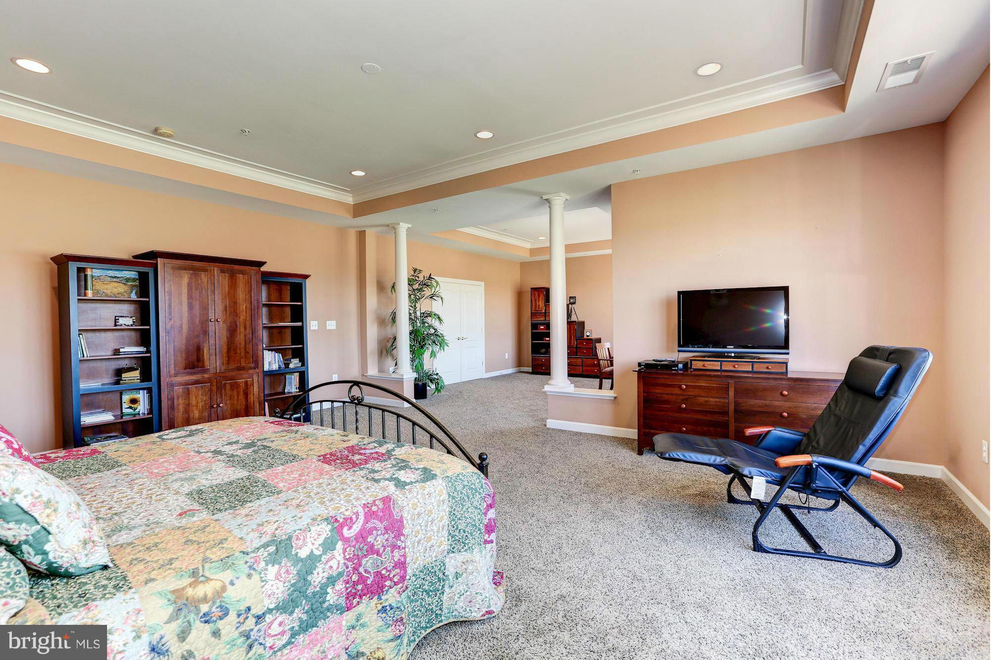 15520 Mount Nebo Road Poolesville, MD 20837 - Photo 19 of 30 a bedroom with a bed and a flat screen tv