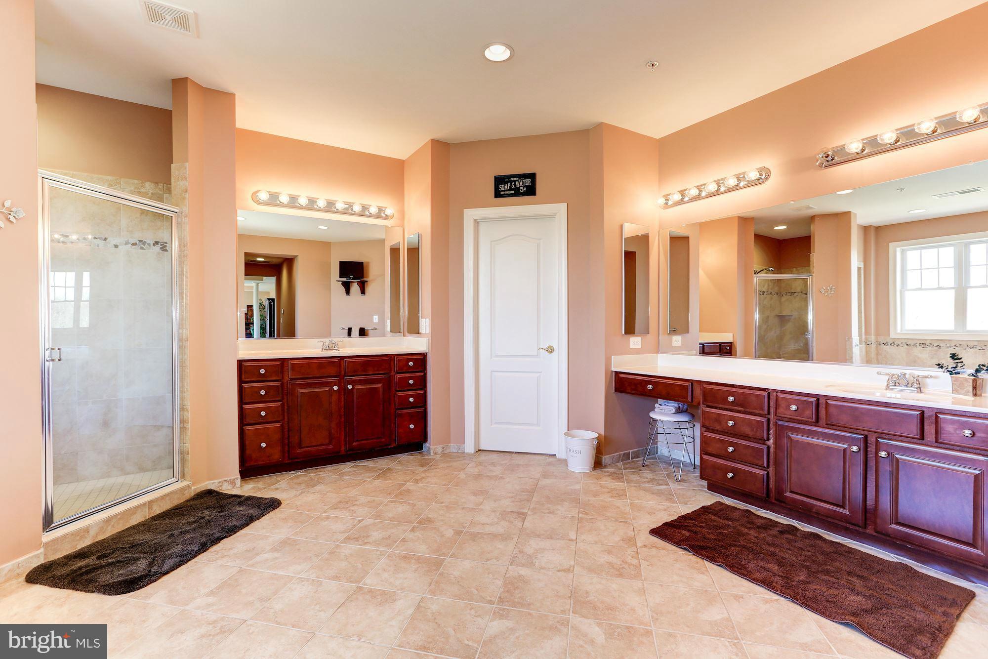 15520 Mount Nebo Road Poolesville, MD 20837 - Photo 21 of 30 a large bathroom with a sink and a large mirror