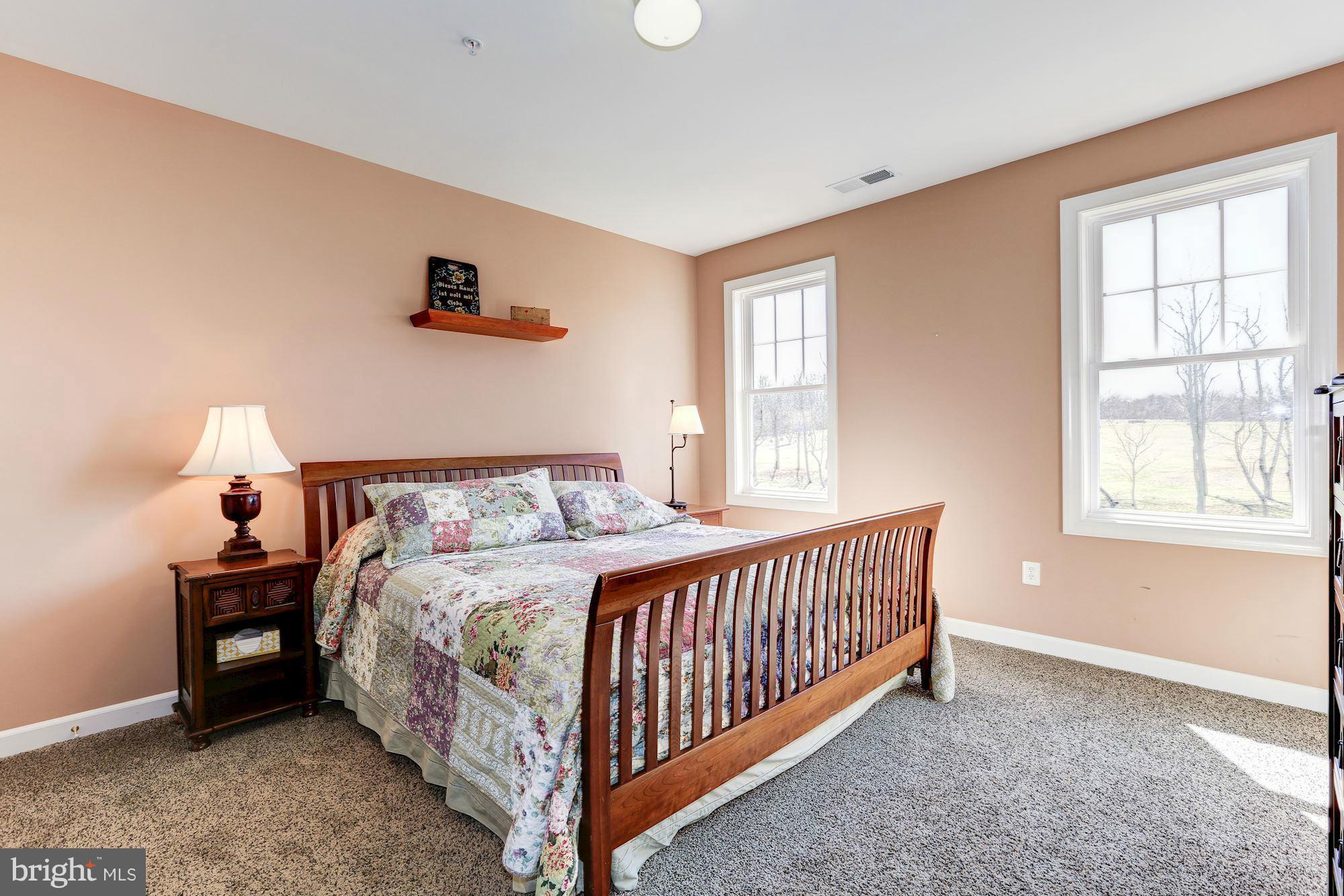 15520 Mount Nebo Road Poolesville, MD 20837 - Photo 22 of 30 a bedroom with a bed and a window