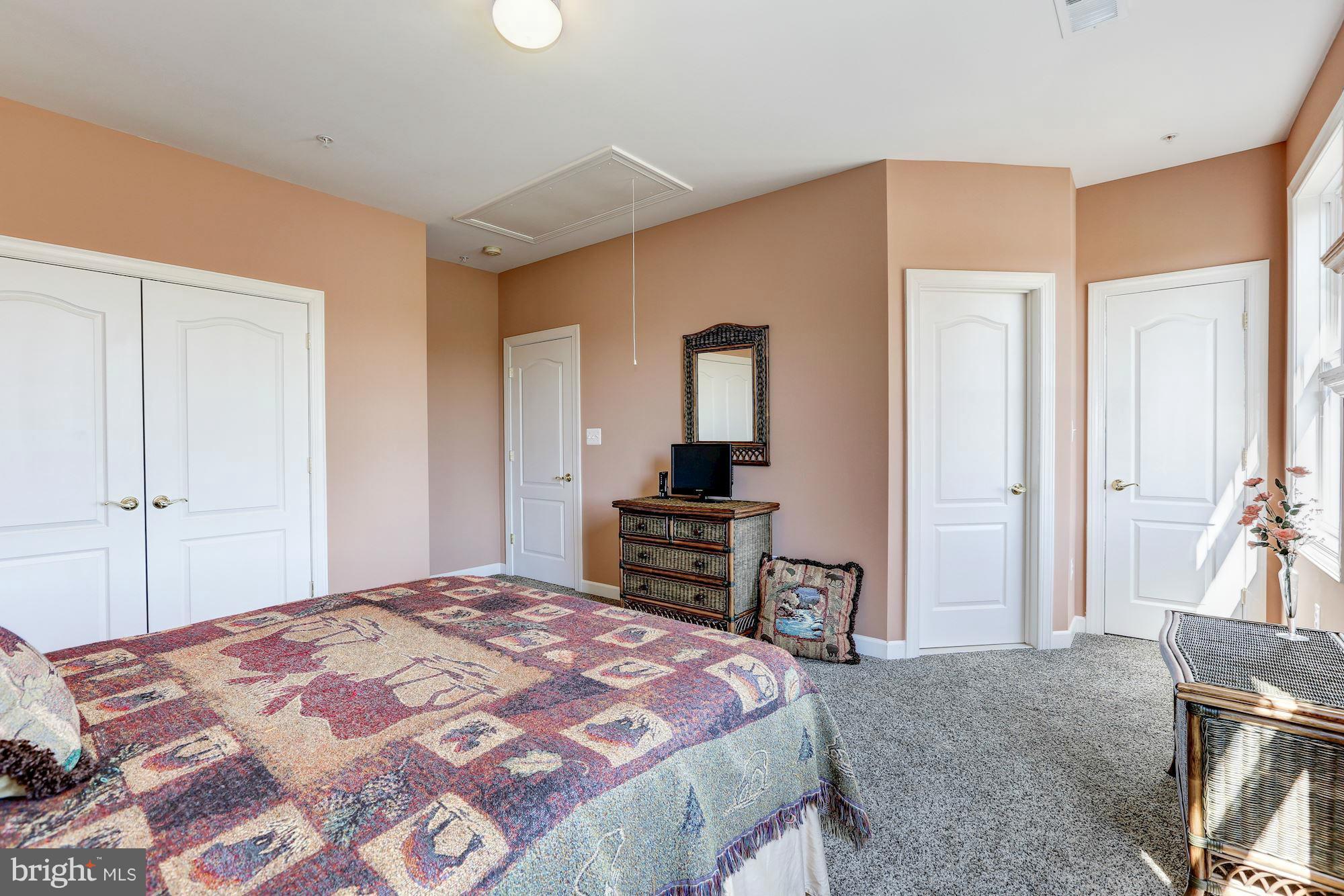 15520 Mount Nebo Road Poolesville, MD 20837 - Photo 24 of 30 a bedroom with a large bed and a dresser