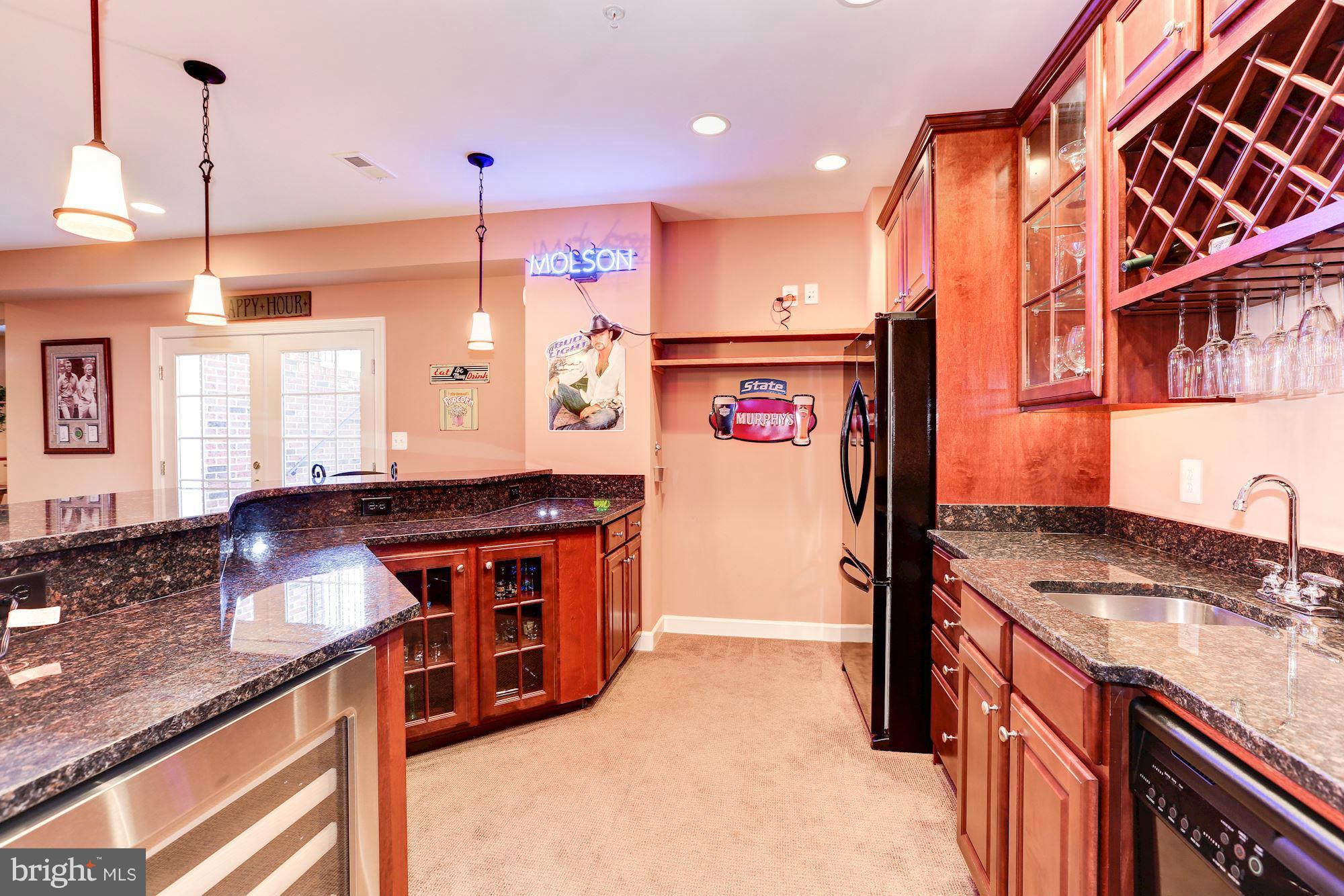 15520 Mount Nebo Road Poolesville, MD 20837 - Photo 26 of 30 a kitchen with stainless steel appliances granite countertop a stove a sink and a refrigerator