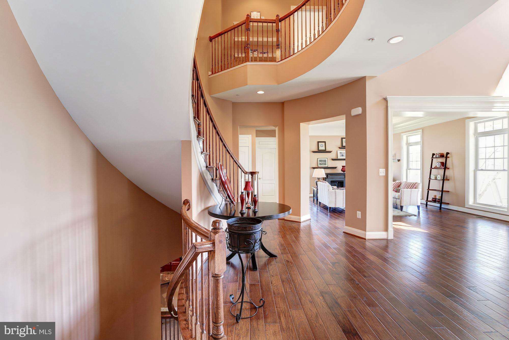 15520 Mount Nebo Road Poolesville, MD 20837 - Photo 5 of 30 a view of a hallway with wooden floor and staircase