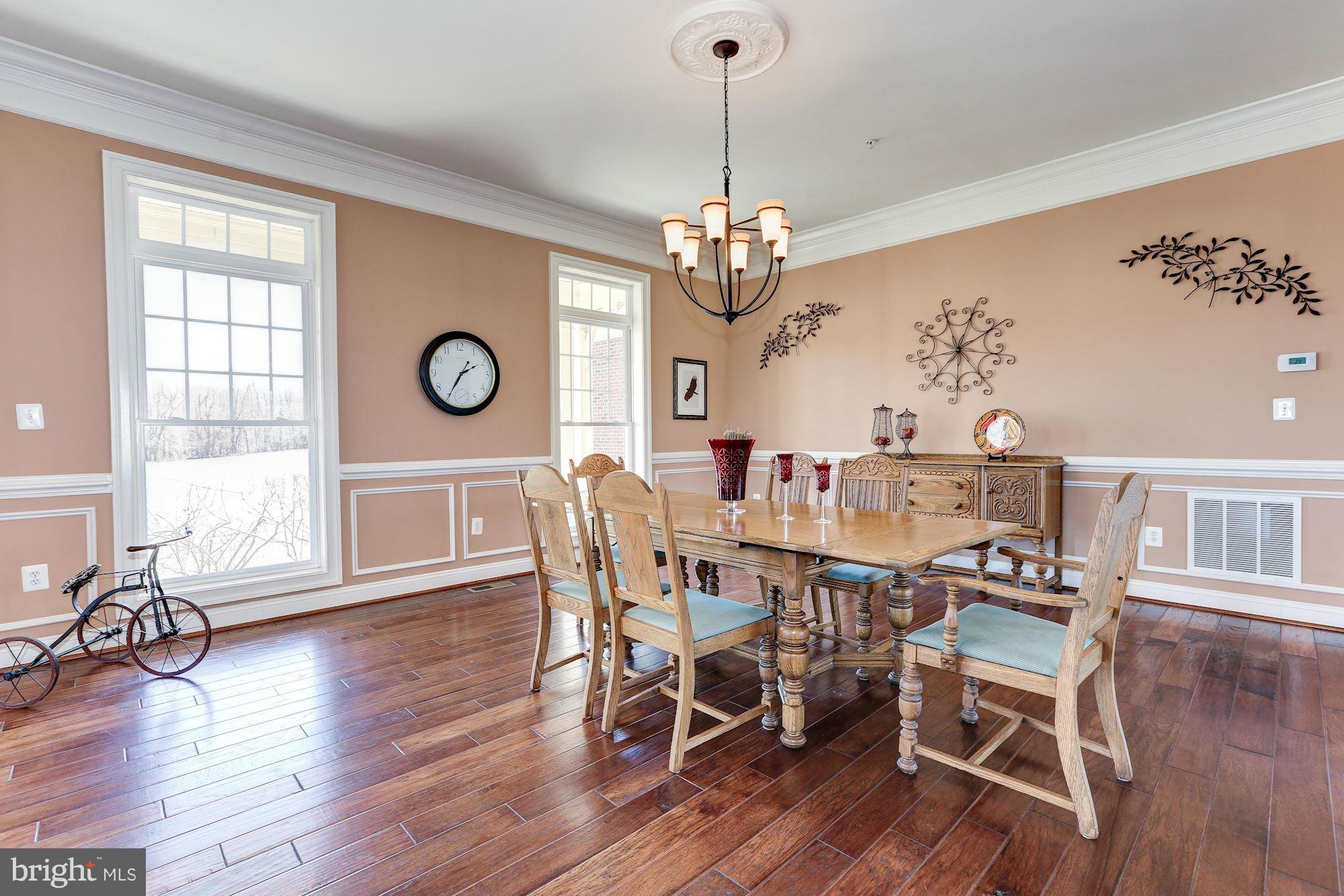 15520 Mount Nebo Road Poolesville, MD 20837 - Photo 9 of 30 a view of a dining room with furniture wooden floor and chandelier