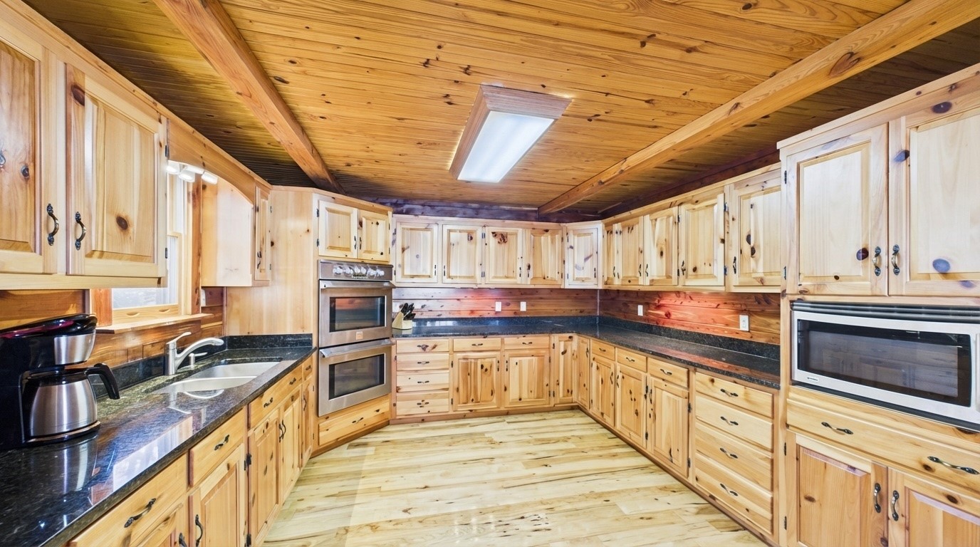22 Roberts Lane Cadiz, KY 42211 - Photo 24 of 84 a large kitchen with stainless steel appliances granite countertop a sink and counter space